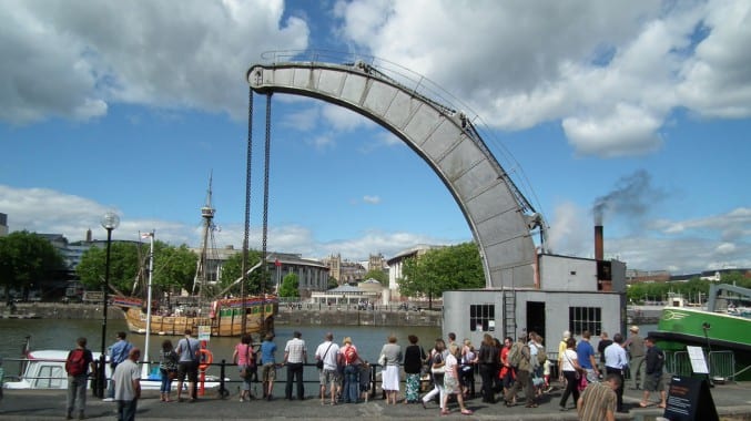 the fairbairn steam crane with people walking past