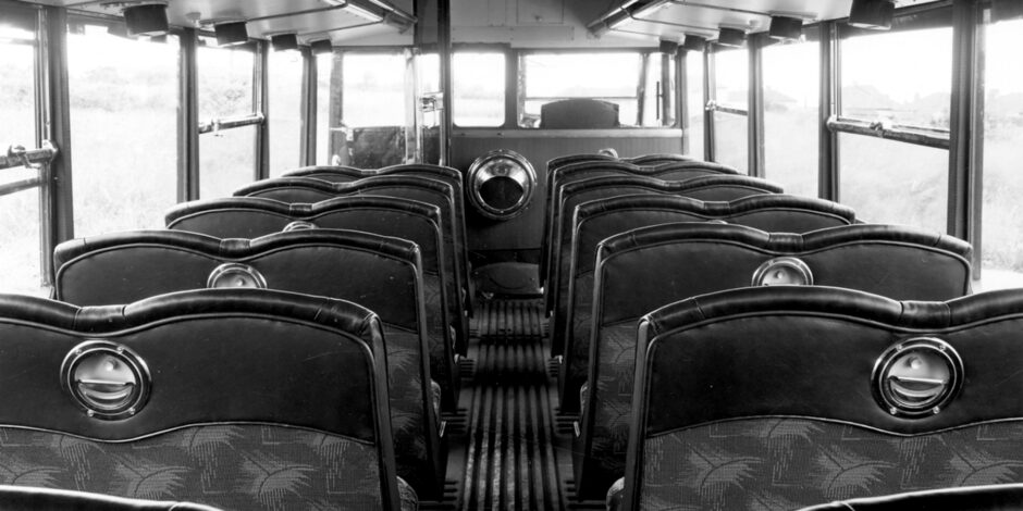 black and white photo of the inside of a bus